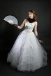 Photo: Girl with fan in white dress Girl with fan in white dress