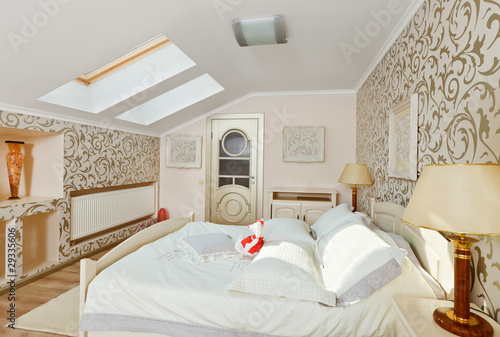Photo: Modern art deco style bedroom interior in light beige colors on Modern art deco style bedroom interior in light beige colors on
