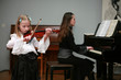 The girl plays a violin