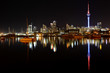 Auckland City night lights reflect on harbor Auckland City night lights reflect on harbor