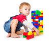 Photo: a funny boy is playing with lego a funny boy is playing with lego