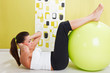 Beauty, young girl behooves gym exercise with ball