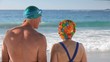 Elderly couple running to the sea