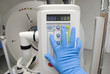 Doctor click an electronic syringe with automatic loading