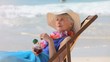 Elderly woman looking at the horizon with a cocktail