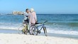Elderly couple looking at the horizon after a ride bike