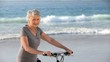 Elderly woman looking at the camera with a bike