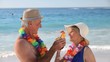 Elderly couple toasting with cocktails