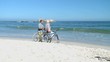 Elderly woman talking with his husband after a bike ride