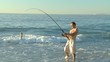 Man fishing on the beach