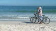 Elderly couple walking with bikes