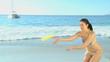 Video: Woman playing frisbee on the beach Woman playing frisbee on the beach