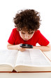 Boy looking through magnifying glass isolated on white Boy looking through magnifying glass isolated on white
