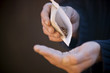 A man pouring seeds into his hand