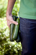 A man holding courgettes