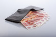 black leather wallet with bills