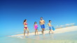 Healthy Family in Swimwear on the Beach filmed 60FPS
