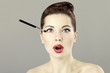 Portrait of beautiful woman with a brush for eyeshadow Portrait of beautiful woman with a brush for eyeshadow