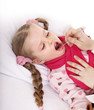 Doctor exams child with sore throat.