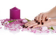 Spa manicure, candle, stones and tulips