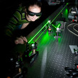 female scientist doing research in a quantum optics lab