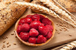 Raspberry cake with traditional bread background