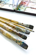 Oil color paintbrushes with palette in background