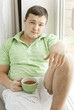 young man drinking tea
