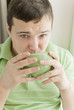 young man drinking tea