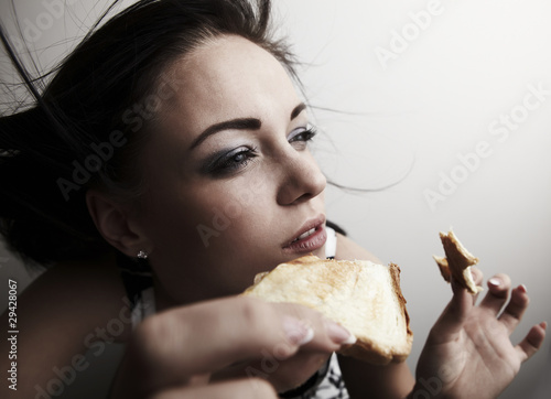 woman holding sandwich