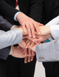 Closeup portrait of group of business people with hands Closeup portrait of group of business people with hands
