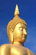 Big golden buddha with blue sky, Ang Thong province, Thailand.
