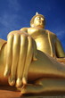 Big golden buddha with blue sky, Ang Thong province, Thailand.