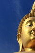 Big golden buddha with blue sky, Ang Thong province, Thailand.