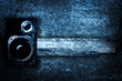 Musical grunge background with speaker.