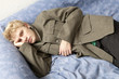 Photo: blond sad man lying on bed blond sad man lying on bed