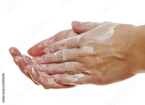 Photo: woman applying cream to her hands woman applying cream to her hands