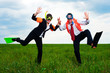cheerful businesspeople dancing on the field cheerful businesspeople dancing on the field
