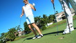 Senior Couple Sinking the Golf Putt
