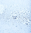Rain water droplets over a blue background