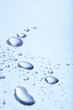 Background of rain water droplets on blue surface