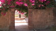 Fountain seen through an arch in Mission San Juan Capistrano Fountain seen through an arch in Mission San Juan Capistrano