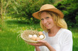 Photo: Happy young woman holding fresh eggs Happy young woman holding fresh eggs