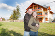 Photo: happy young couple in front of house happy young couple in front of house