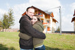 Photo: happy young couple in front of house happy young couple in front of house