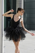 ballerina in black tutu dancing