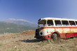 bus wreck in arid landscape