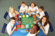 Overhead View Of Schoolchildren Working Together At Desk Overhead View Of Schoolchildren Working Together At Desk