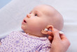 cleaning ear of baby with cotton swabs