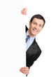 Young businessman holding a blank billboard Young businessman holding a blank billboard